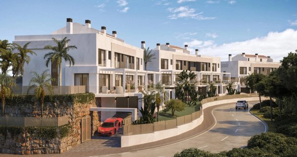 Modern 3-bed townhouse exterior with landscaped gardens in Mijas, Costa del Sol.