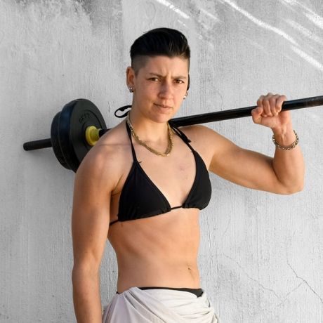 Portrait of Rebekah-Breeze with a barbell resting on the shoulder