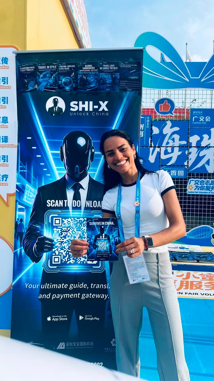 A visitor holding printed material at Canton Fair