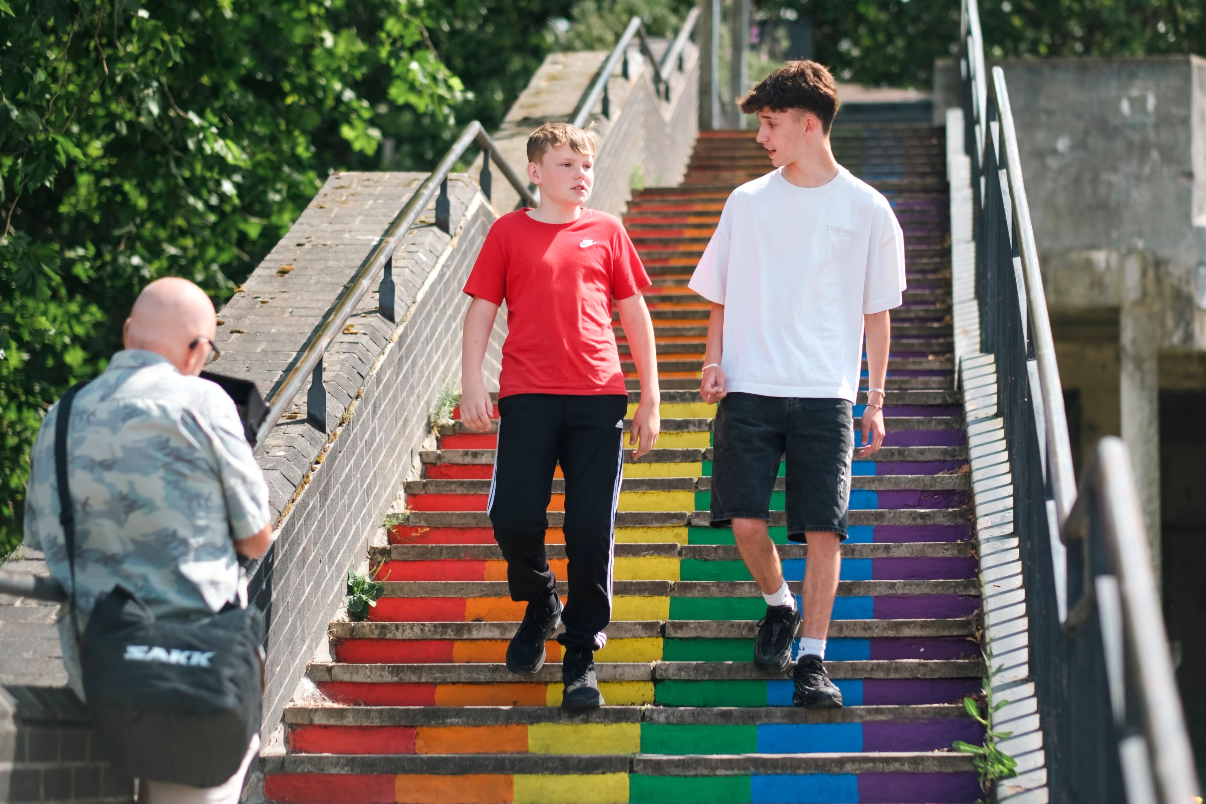 Two teenagers filmed walking down rainbow-painted steps for the BeU Swindon campaign