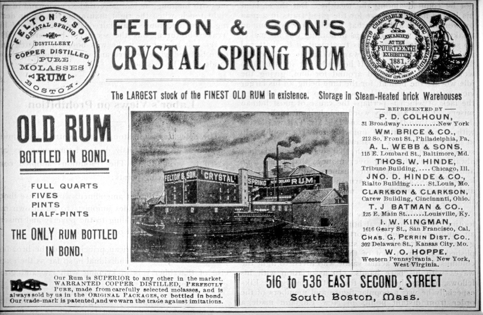 Newspaper advertisement for Felton & Son's Crystal Spring Rum, a copper-distilled molasses rum from South Boston, with an engraving of the company's waterfront distillery and "New England Rum" painted across its wall.
