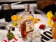 A guest tasting rum at the Mount Gay table during Boston Rum Week