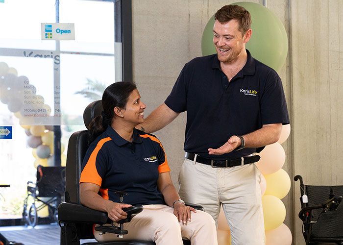 Customer trialling a dual-motor rise recliner chair at Karis Life Hornsby showroom — how to choose a rise recliner