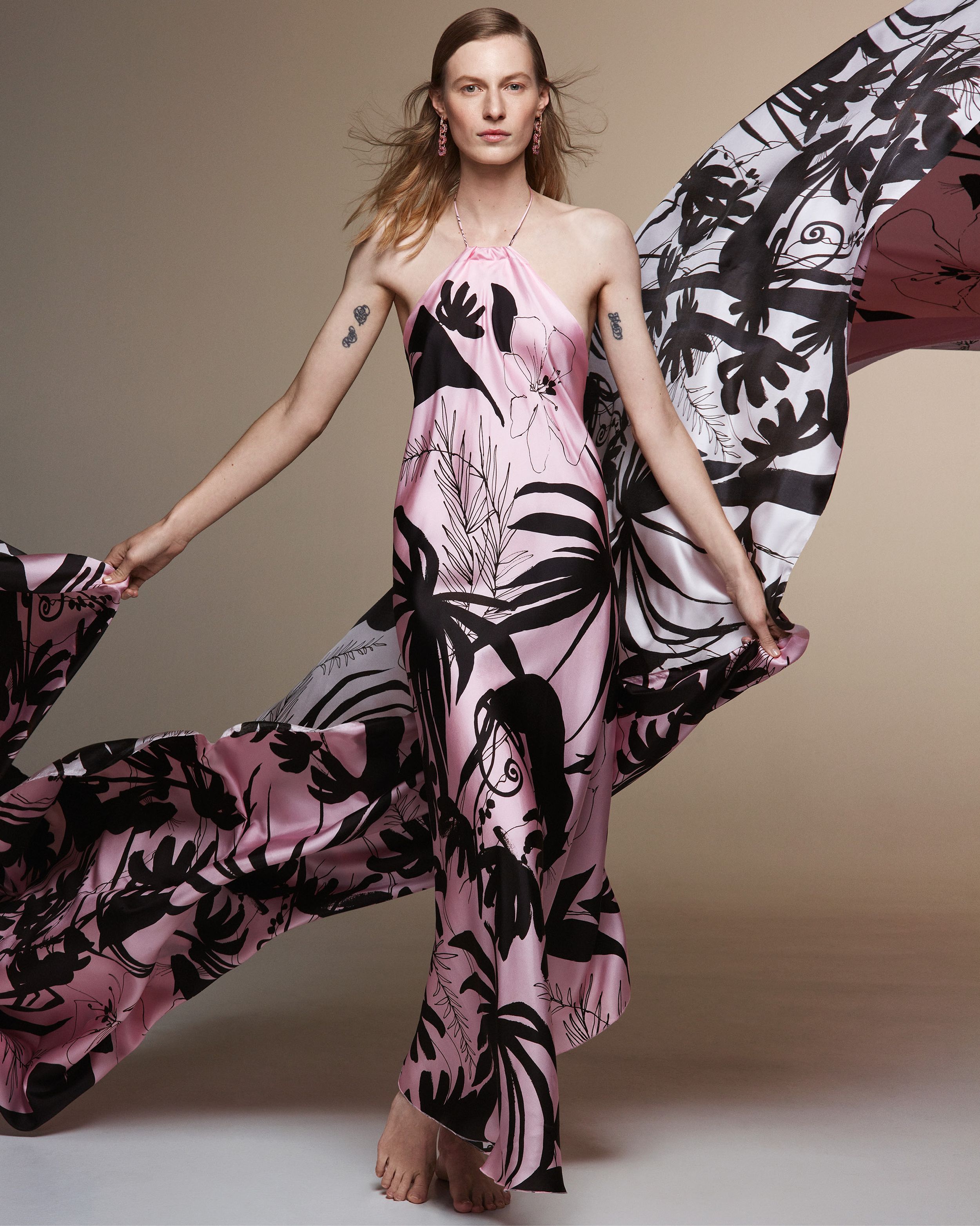 Julia Nobis wearing a long silk halterneck dress with black jungle print