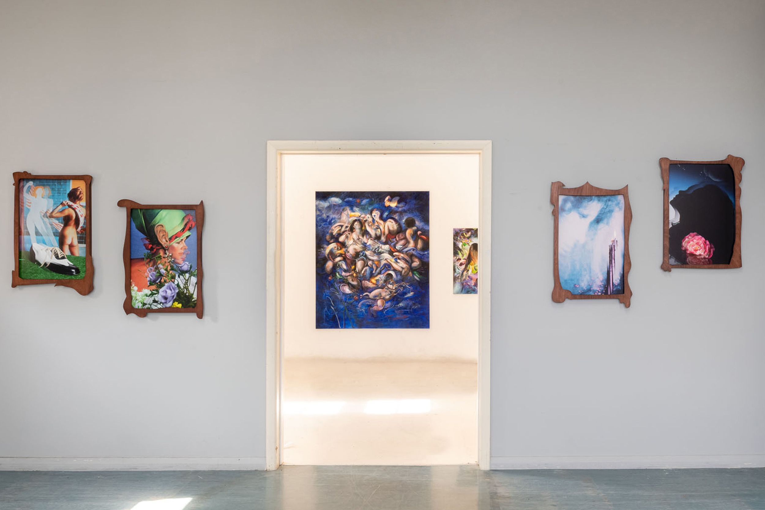 Gallery wall of brightly-coloured modern paintings