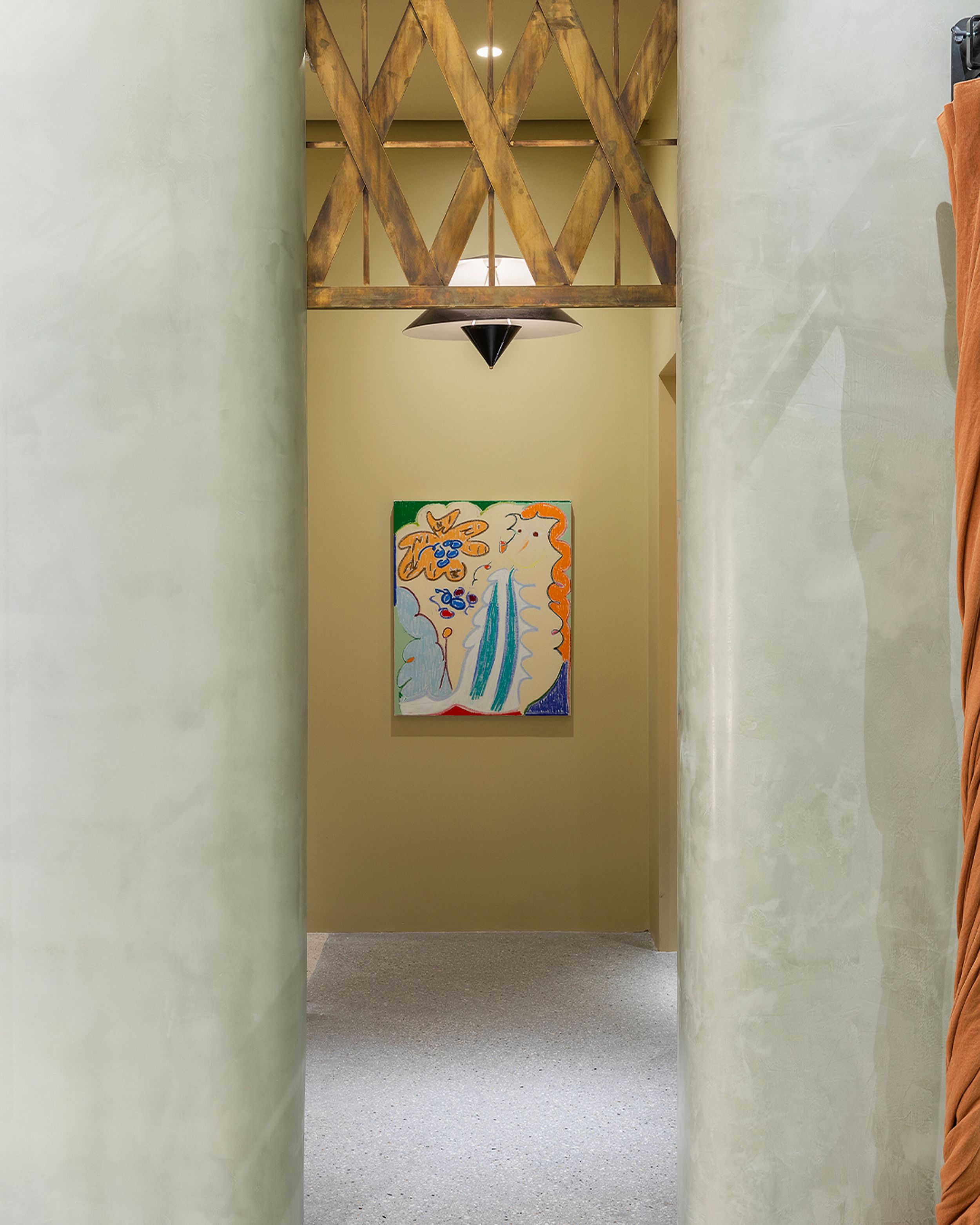 Concrete hallway with a colourful abstract painting at the end