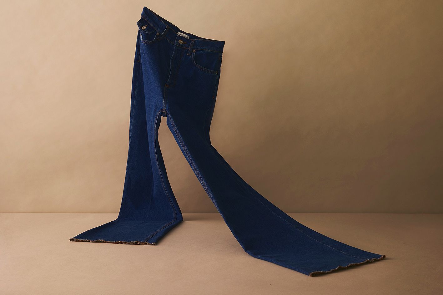 Scanlan Theodore long wide leg denim jeans in a deep indigo hue.