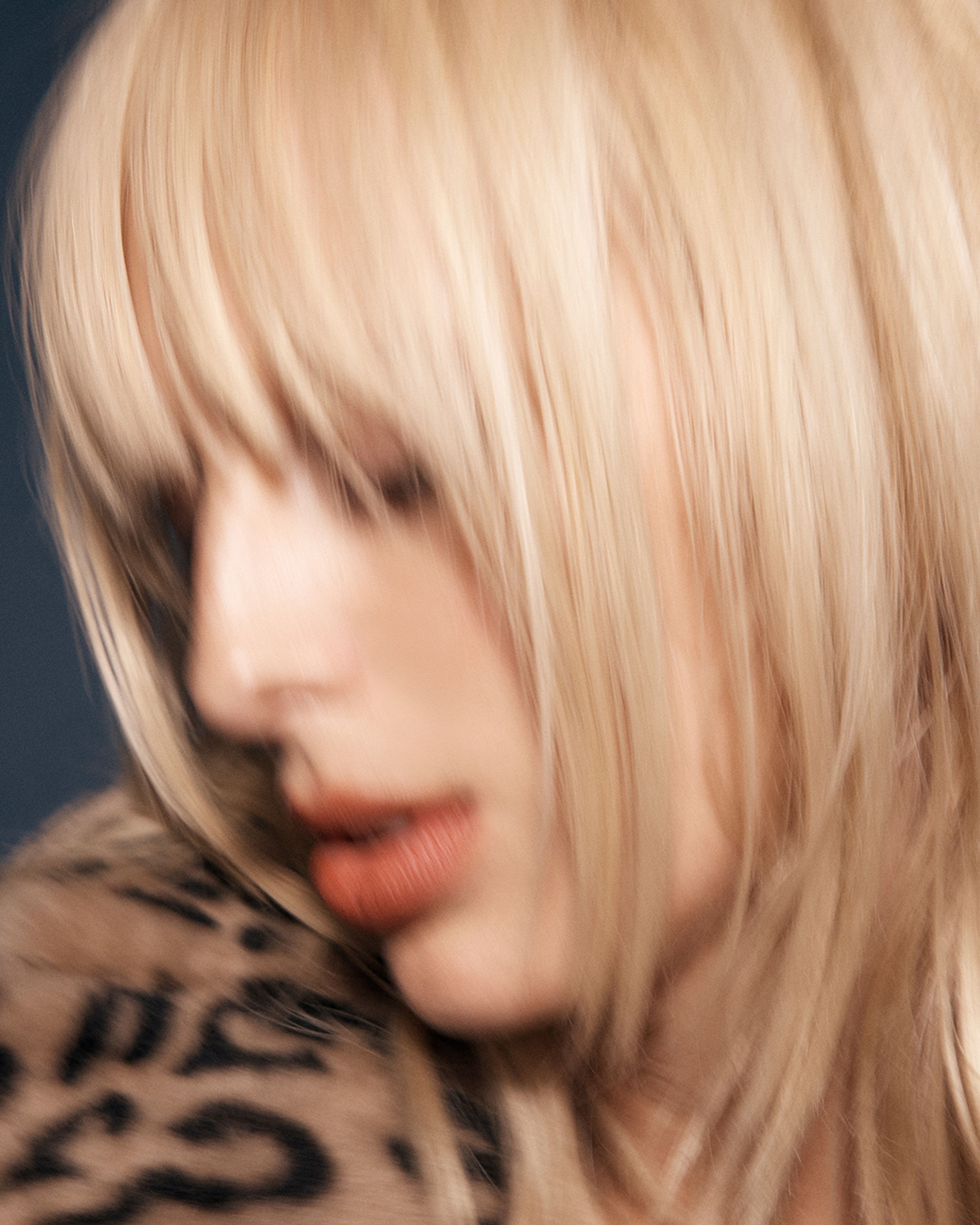 Slightly-blurred close up of blond model's face