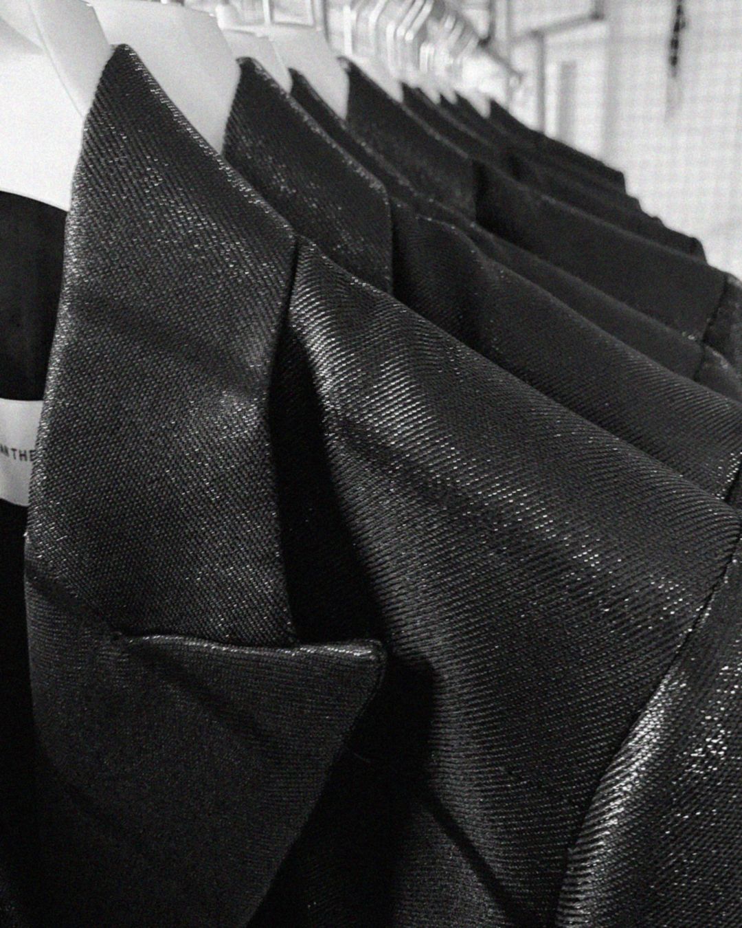 Clothing rack with black blazers