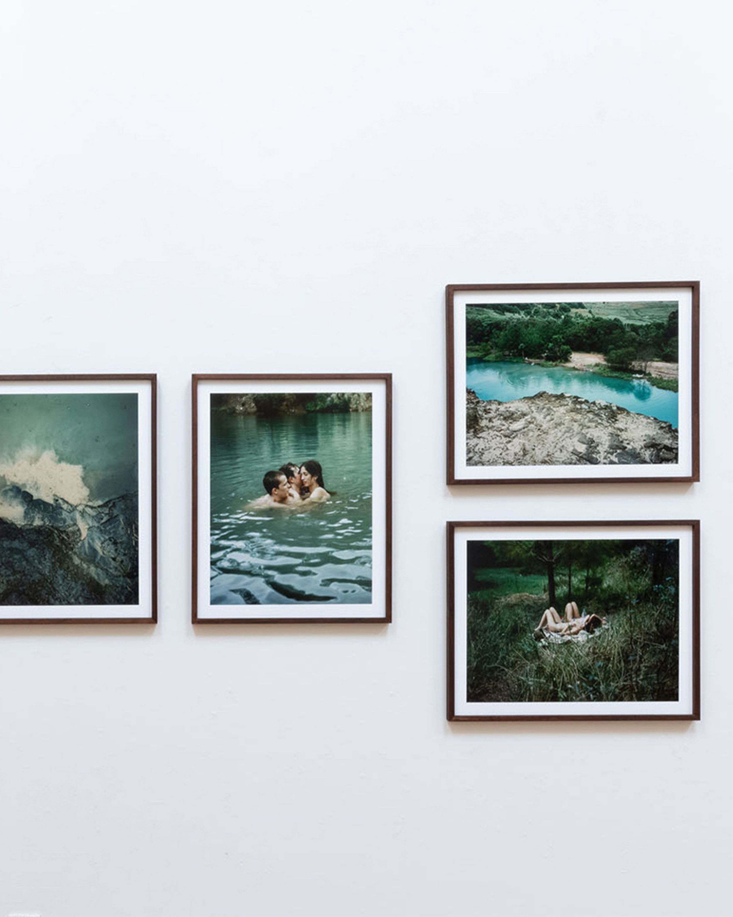 Gallery wall of photographs featuring people swimming in a lake and in nature