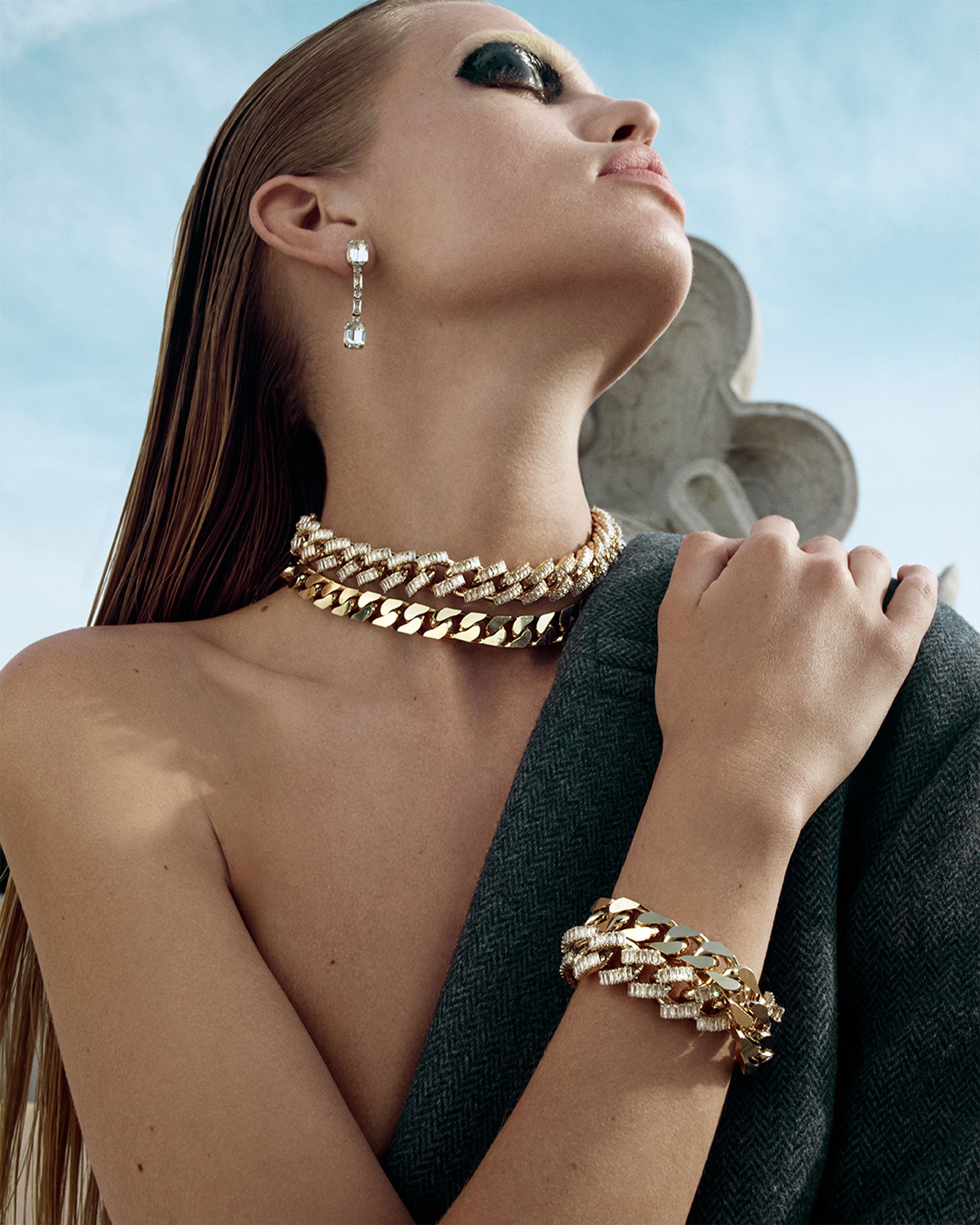 Cose up shot of blonde model wearing chunky gold jewellery - Winter 2023 Part 2