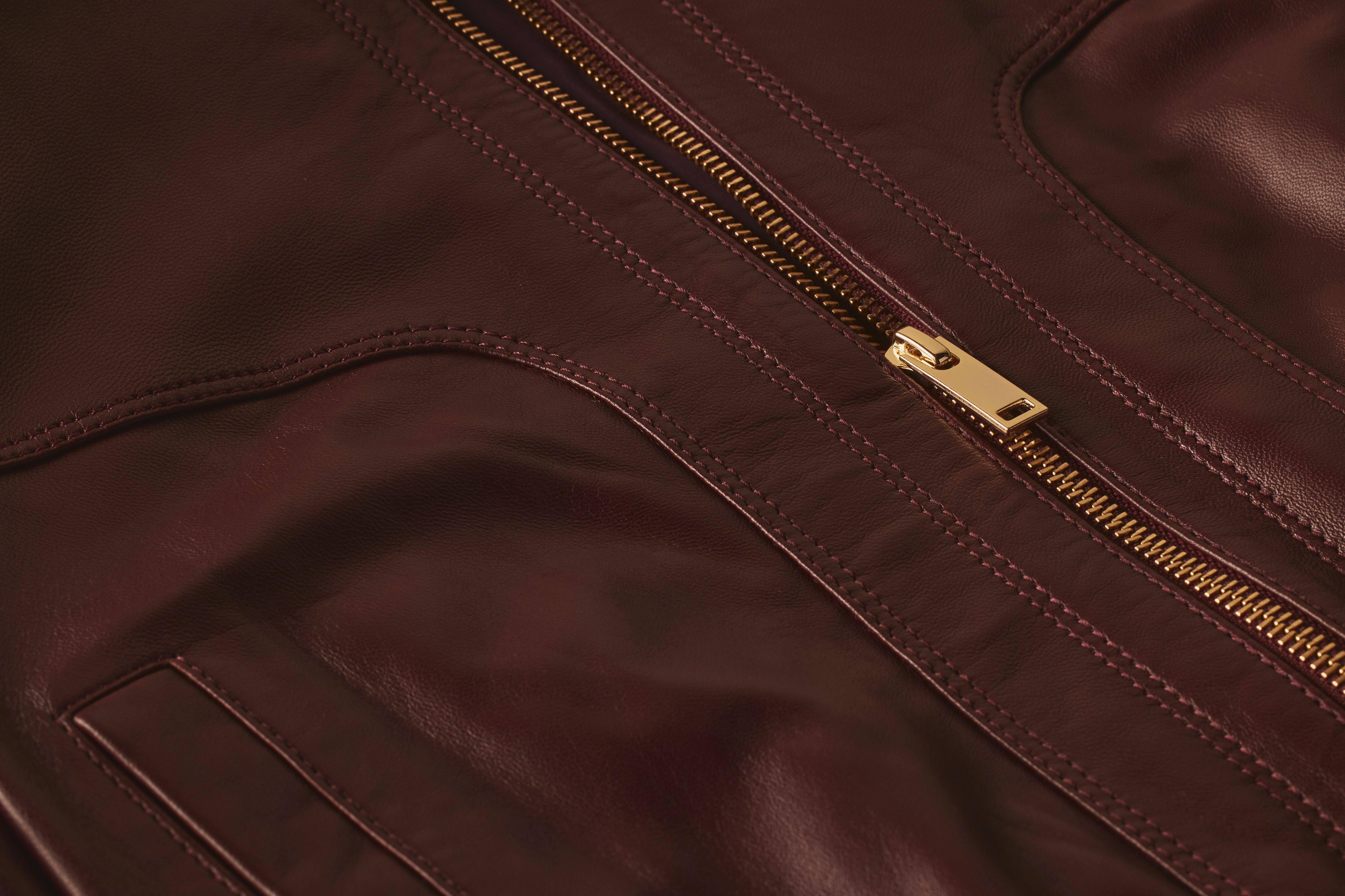 Scanlan Theodore leather bomber jacket with close detailed view of stitch detail and zipper. 