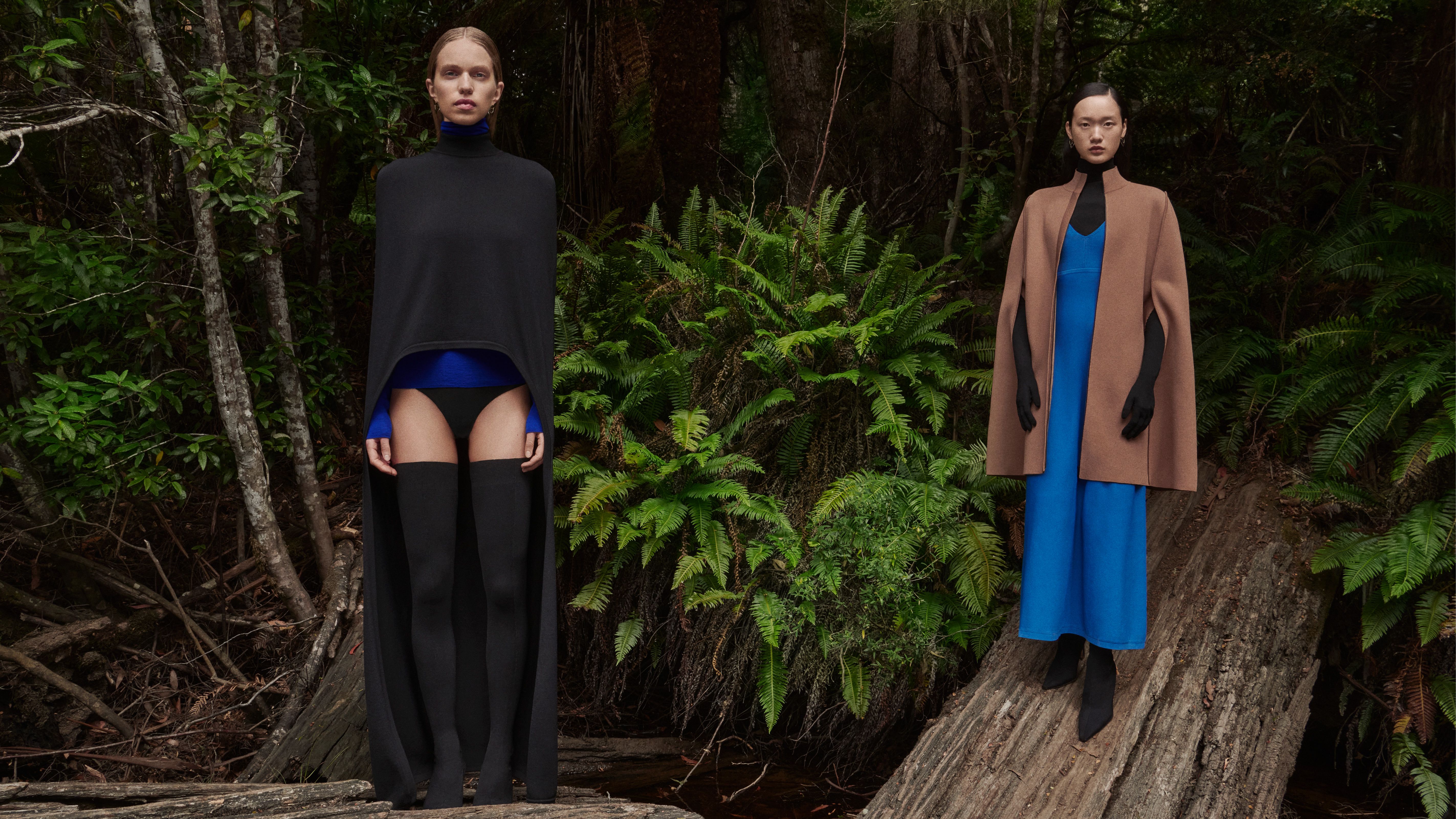 Sabine Glud and Venus He standing in the forest wearing Crepe Knit clothing in shades of black, camel and cobalt