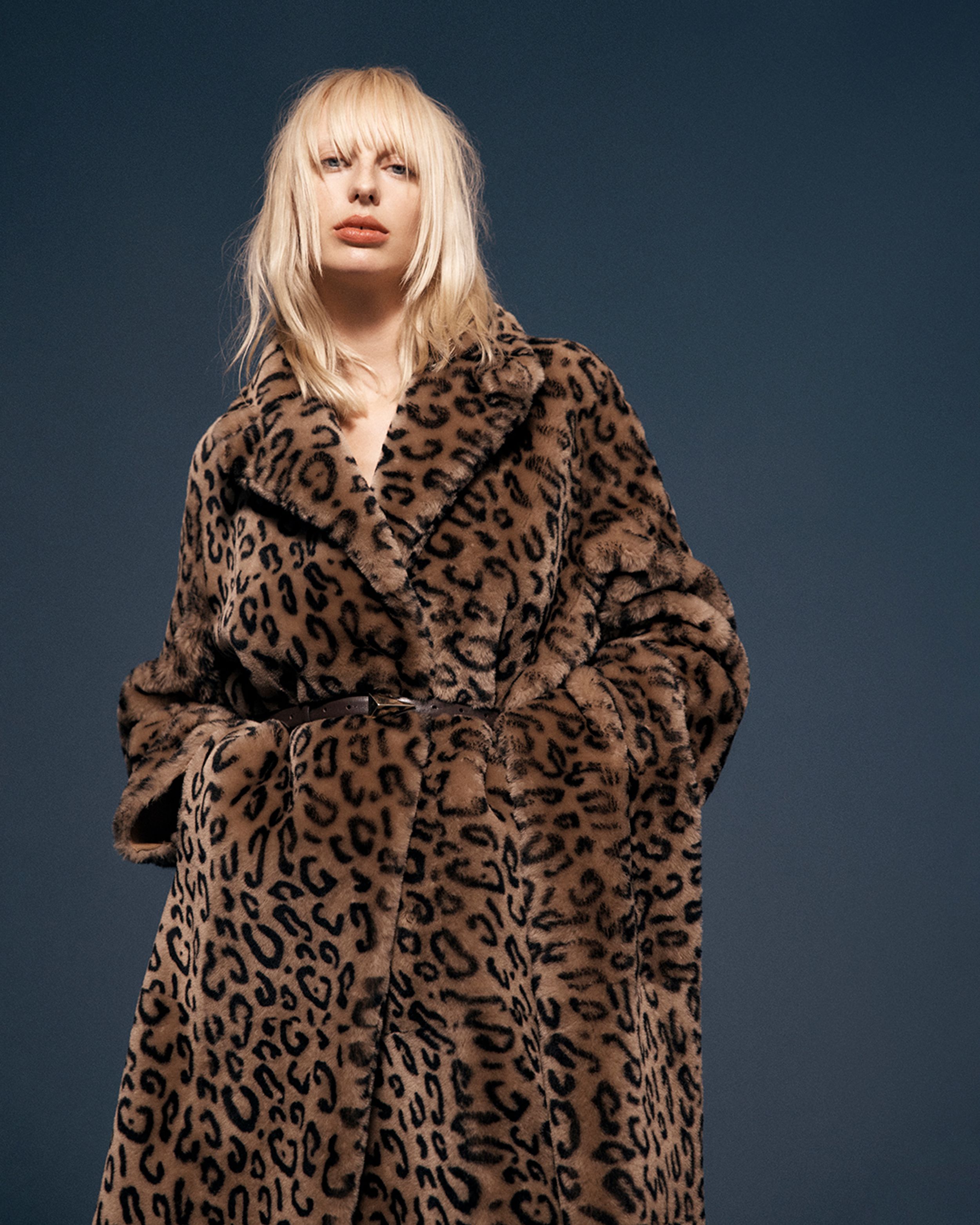Blonde model wearing a leopard-print coat