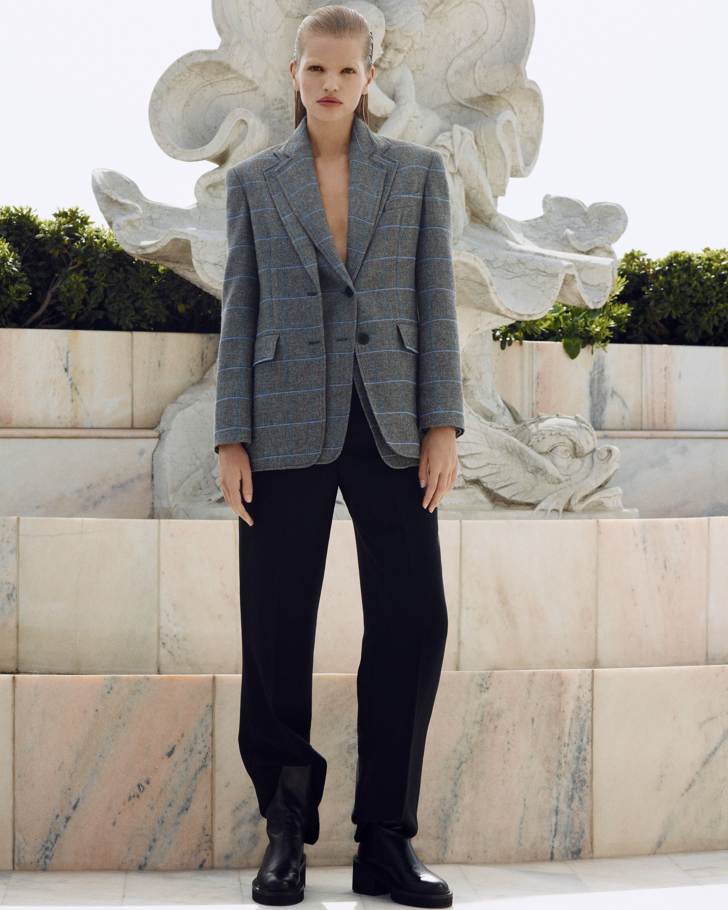 Model standing outdoors in Grey Plaid Jacket, Black Tailored Trousers - Winter 2023 Part 2