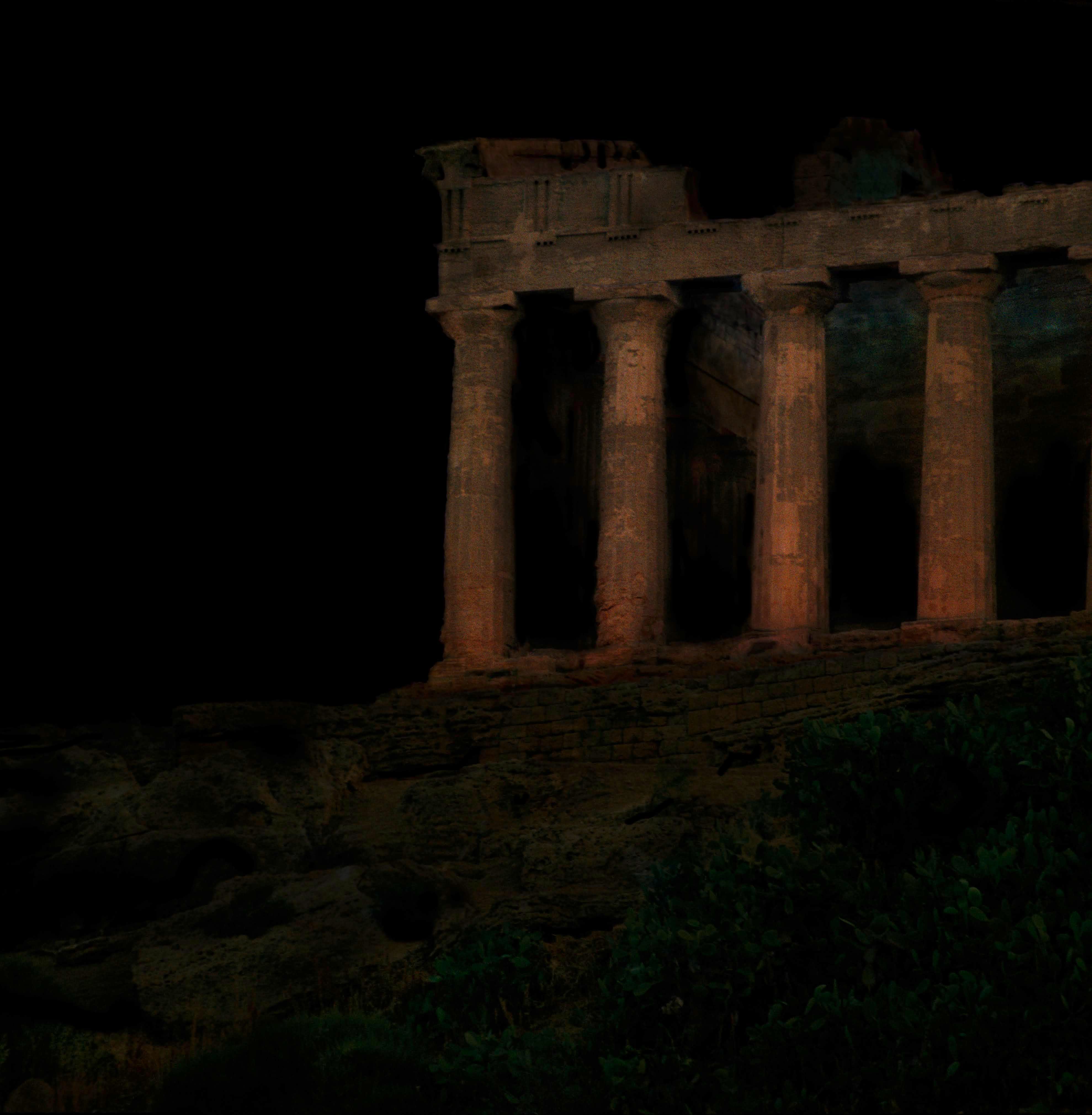 Ancient Greek temple ruins in the dark