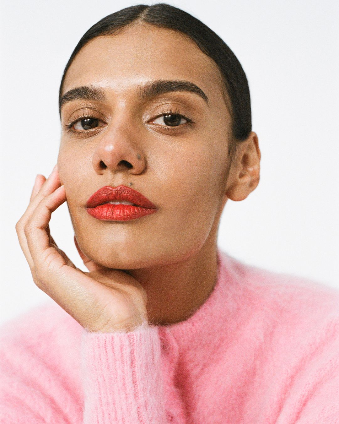 Madeleine Madden wearing pink mohair cropped cardigan and bright coloured lipstick