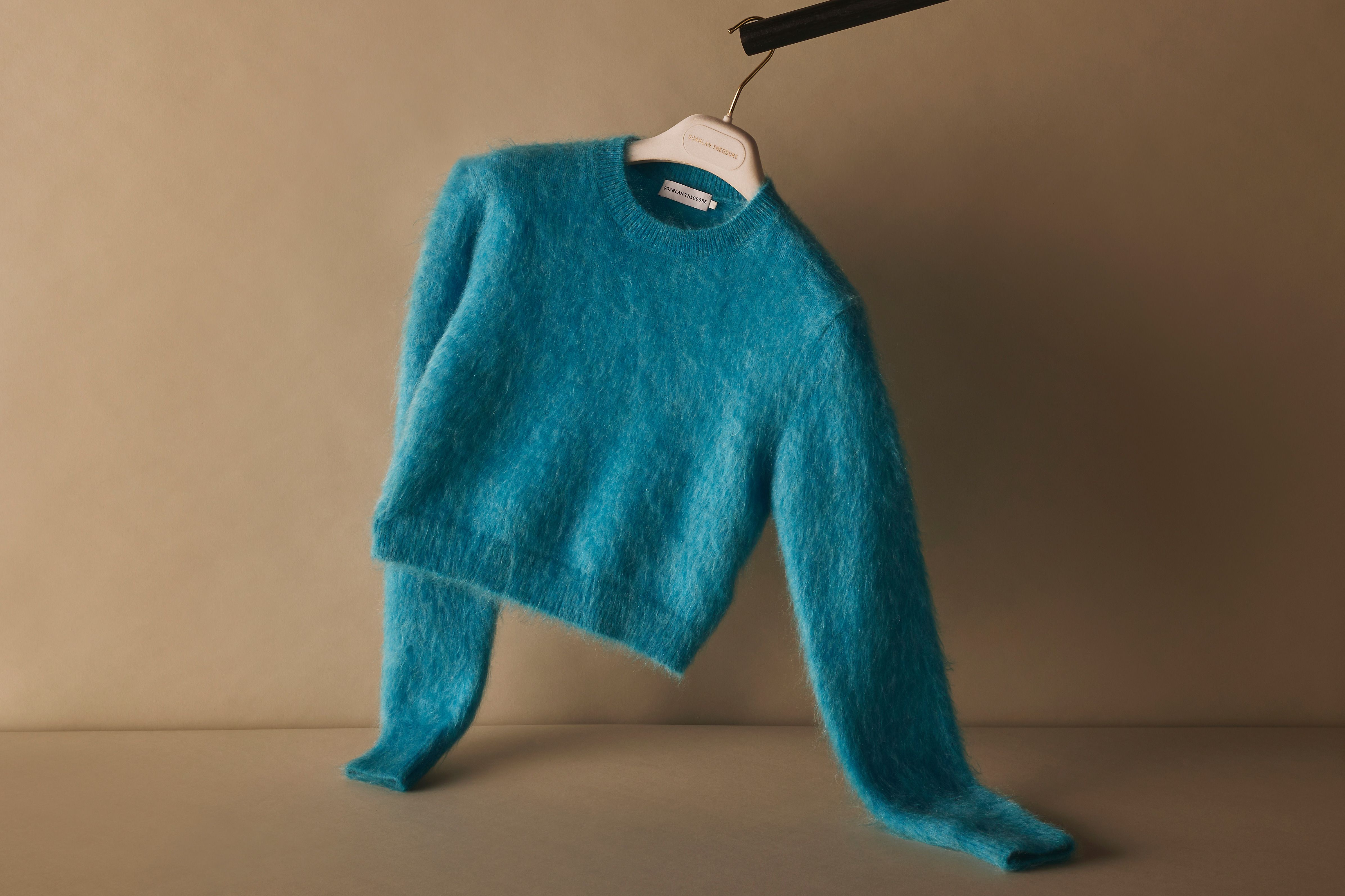 Scanlan Theodore brushed mohair sweater hanging on a rail.