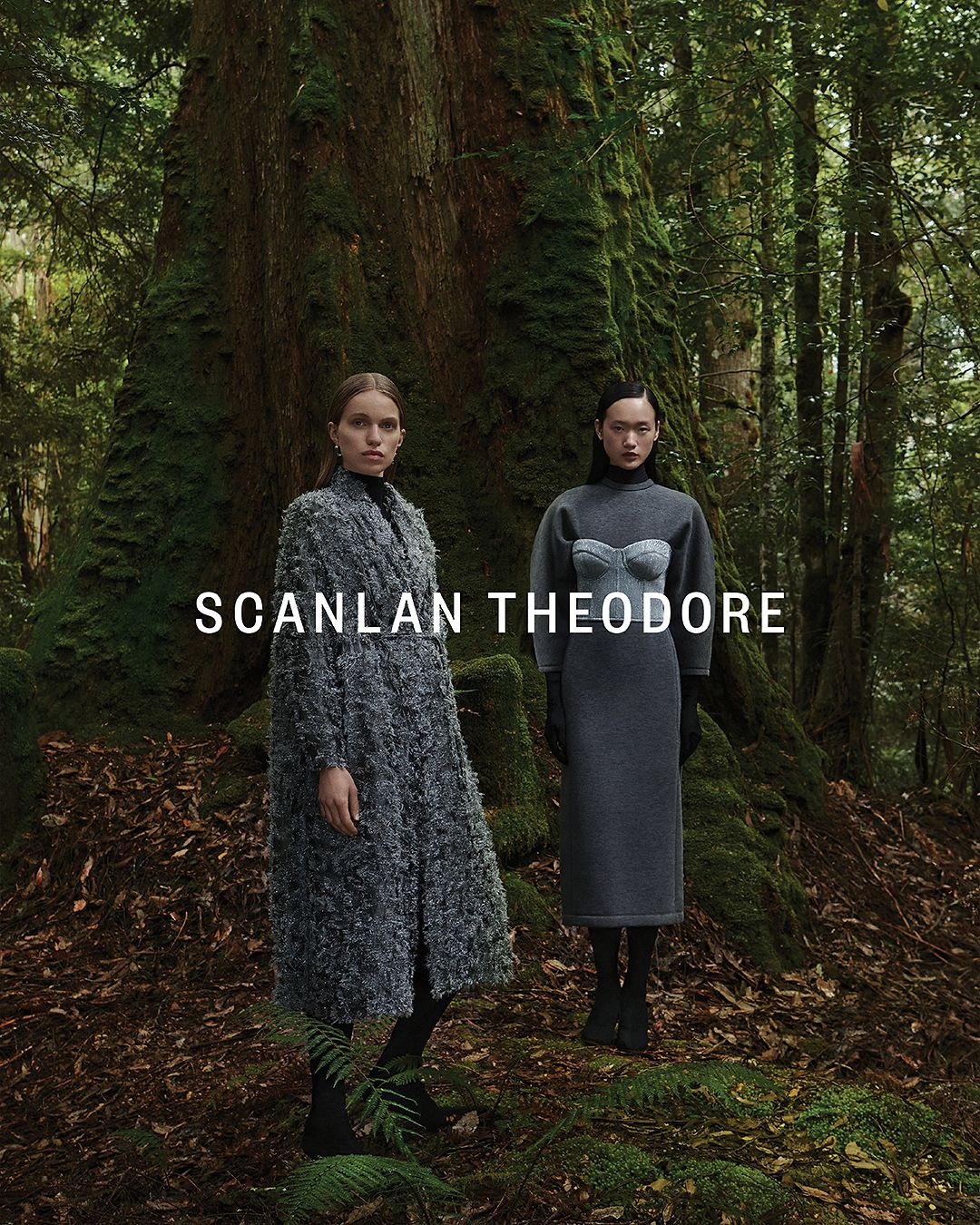 Venus He wearing a charcoal long-sleeved dress with silver bustier on top and Sabine Glud wearing a shimmery opera coat