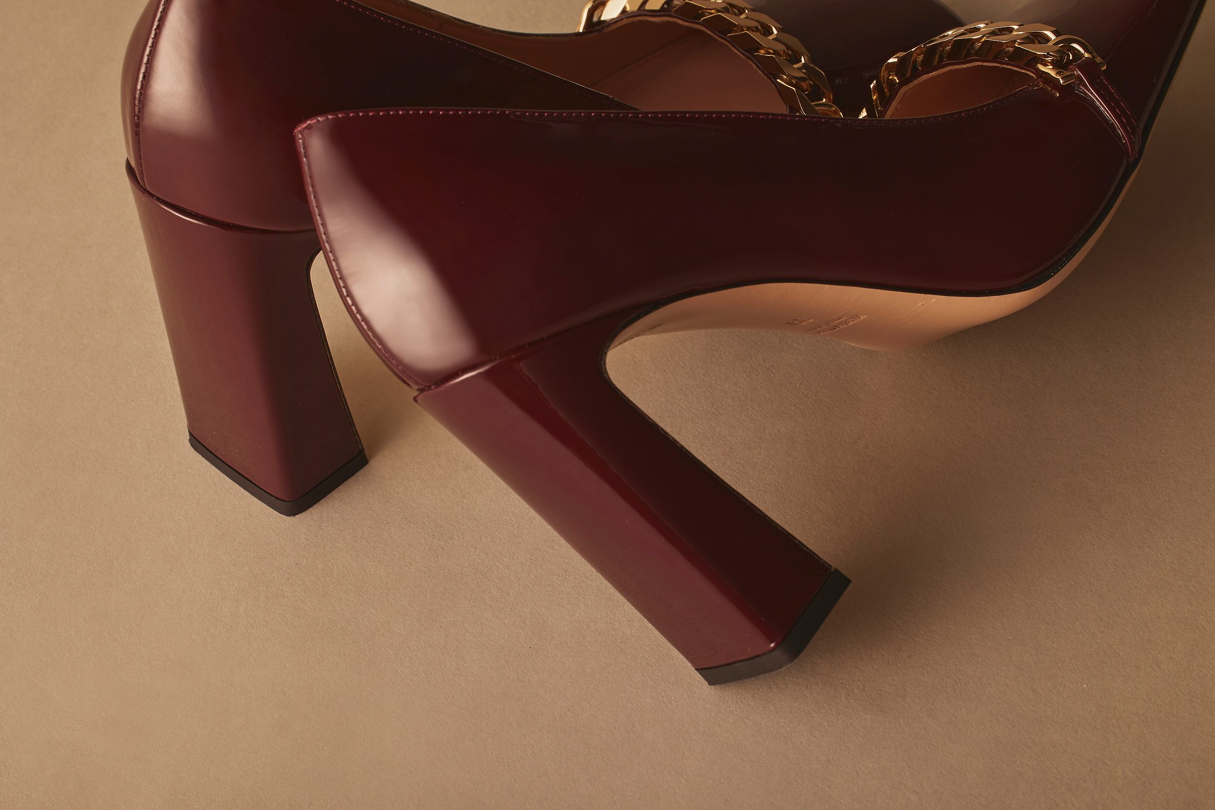 Scanlan Theodore square toe pump with gold chain detail and block heel.