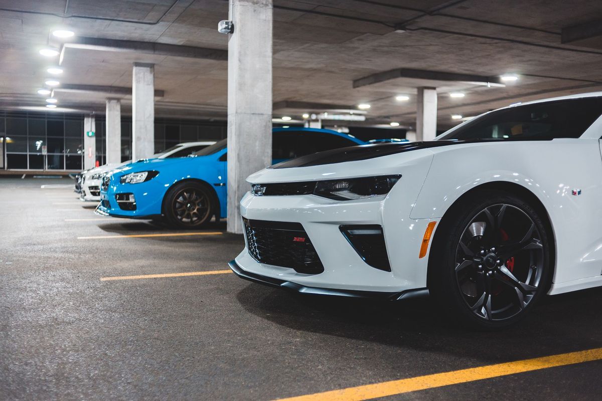 Rows of cars parked in a multi-level parking garage
