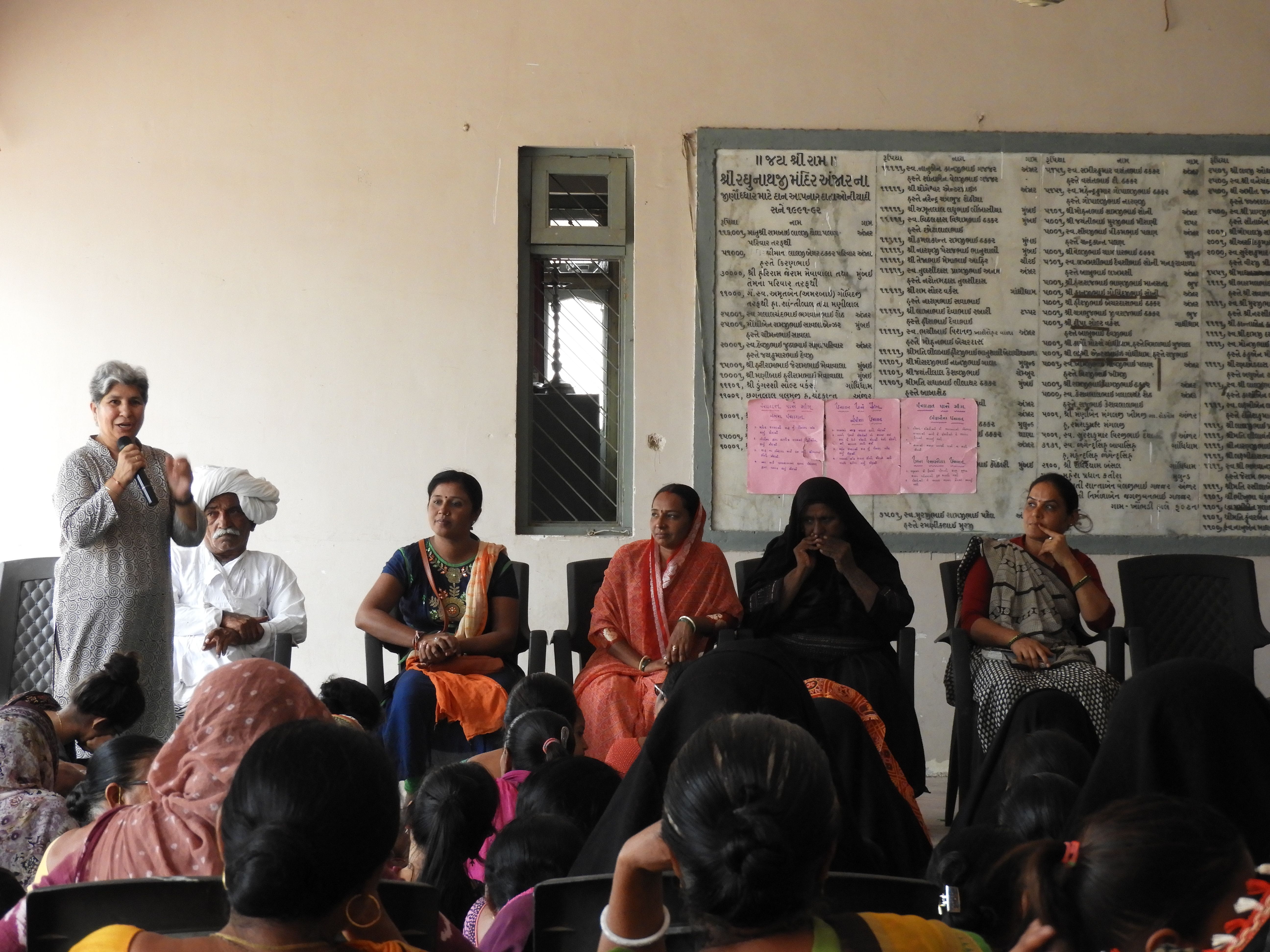 A person giving a speech in front of an audience