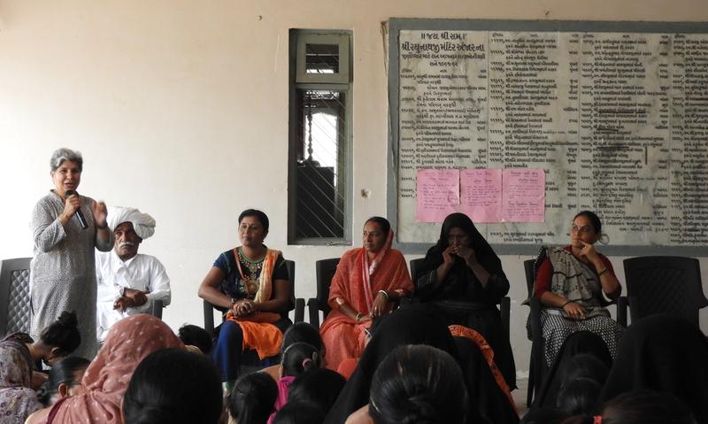 A person giving a speech in front of an audience