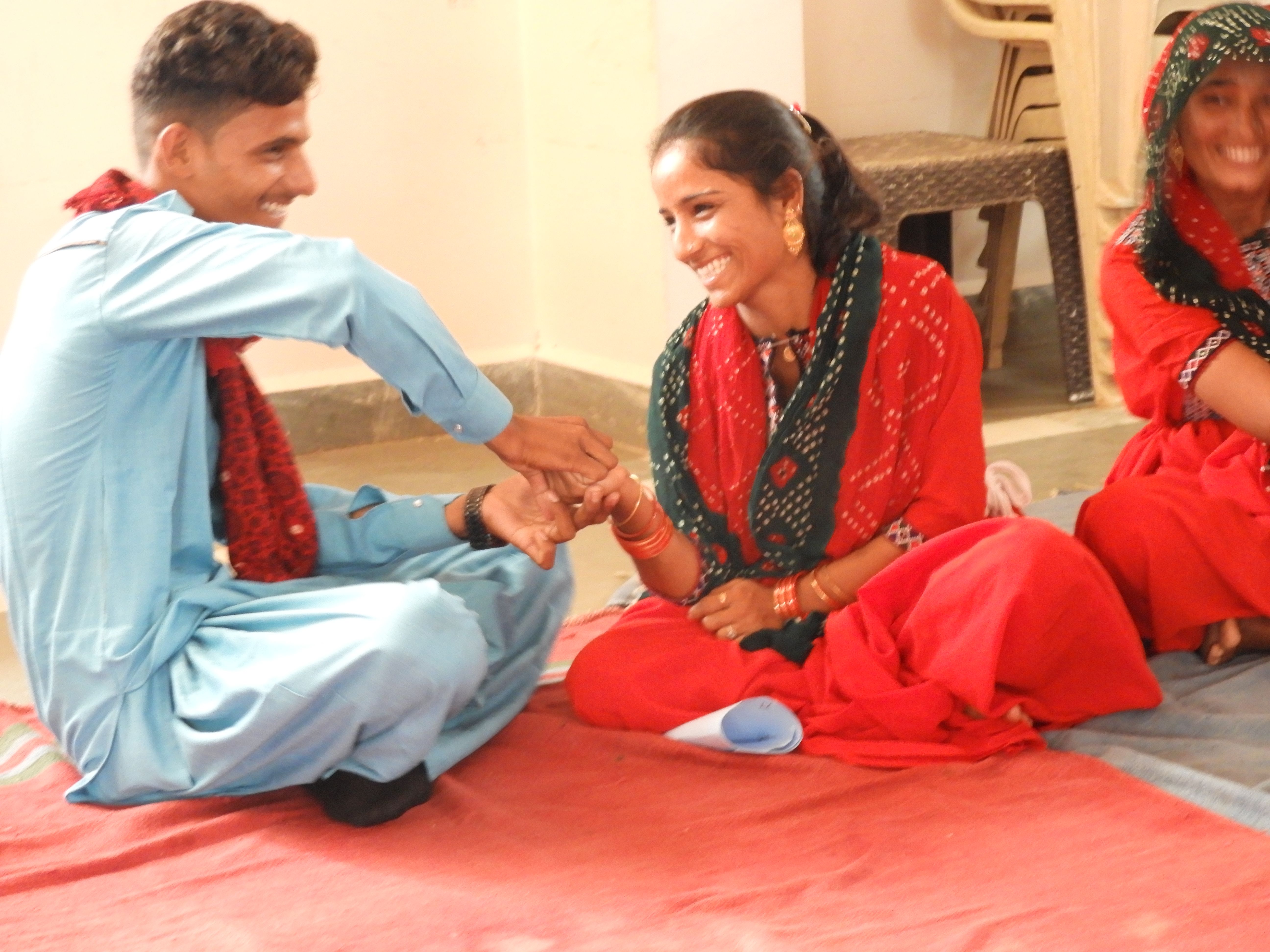 A man and woman sitting together and smiling