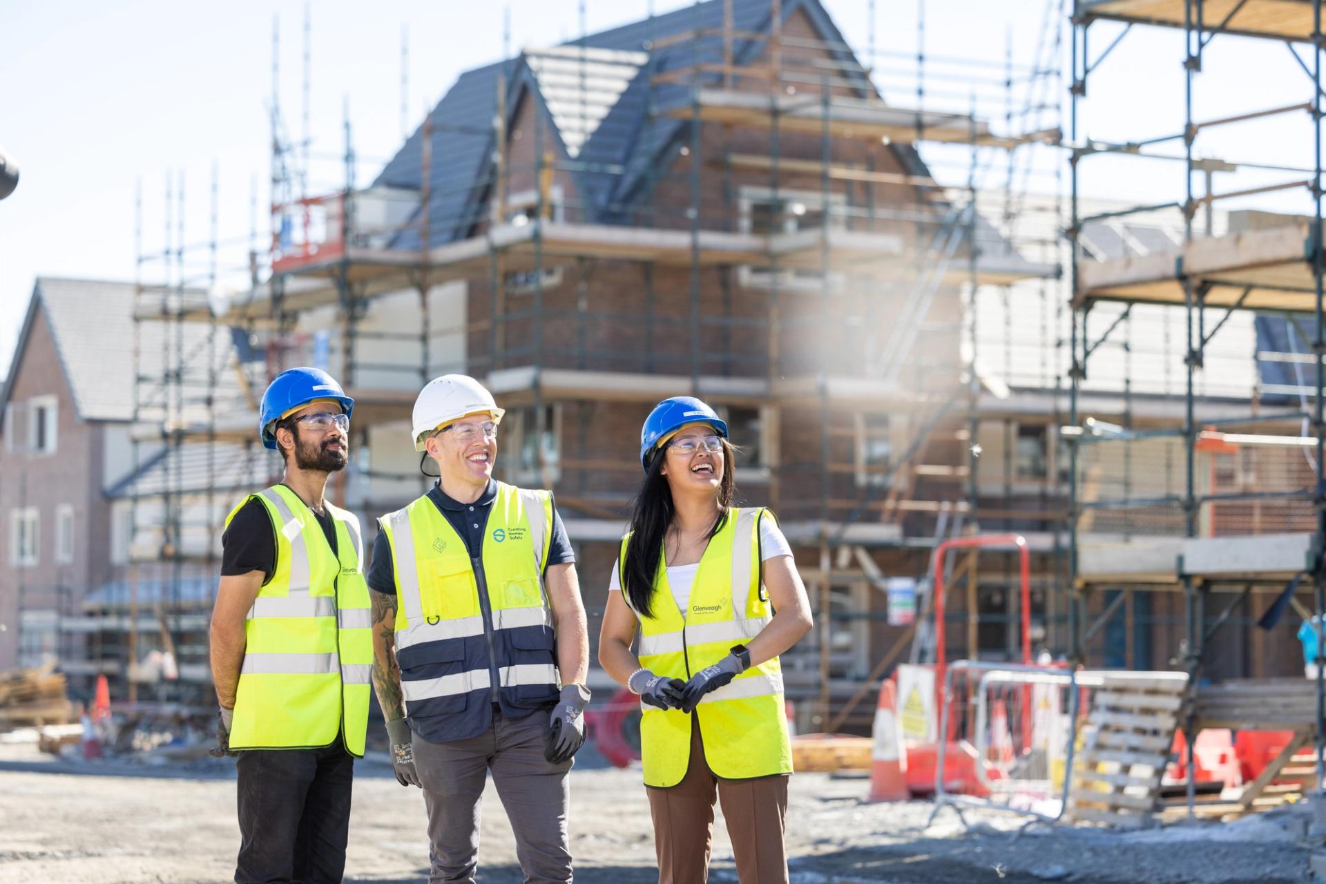 Construction Worker Building Timber Frame In New Home