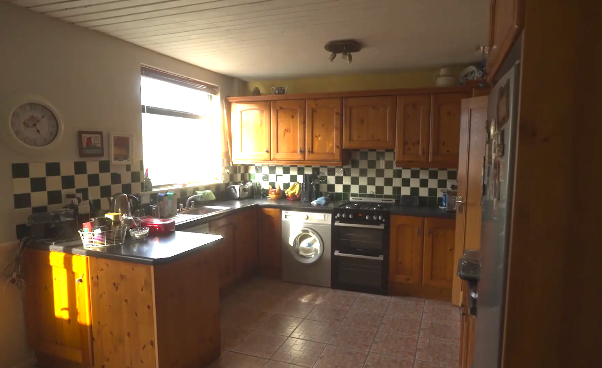 Second-hand kitchen with wooden cabinets
