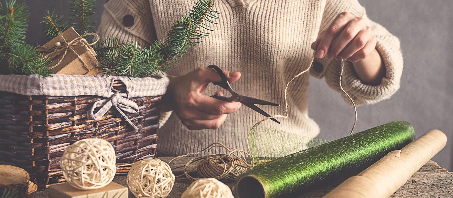 Woman making homemade, sustainable Christmas decorations.