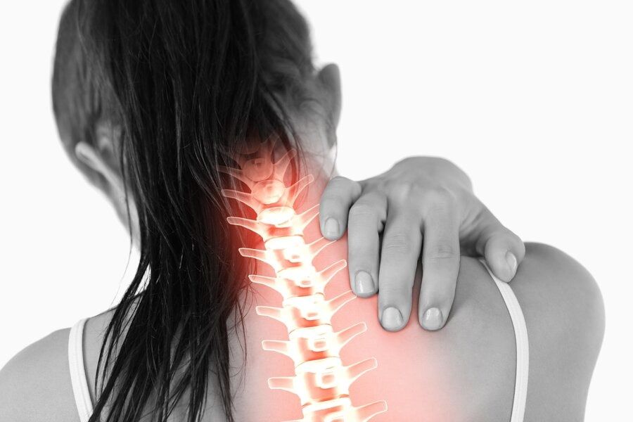Woman experiences neck and upper back pain
