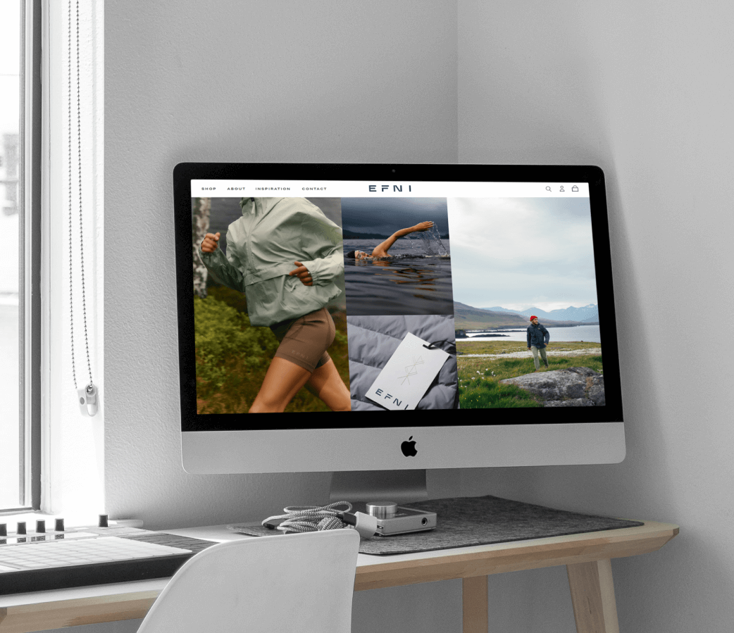 An image of a Mac on a desktop displaying the Efni website