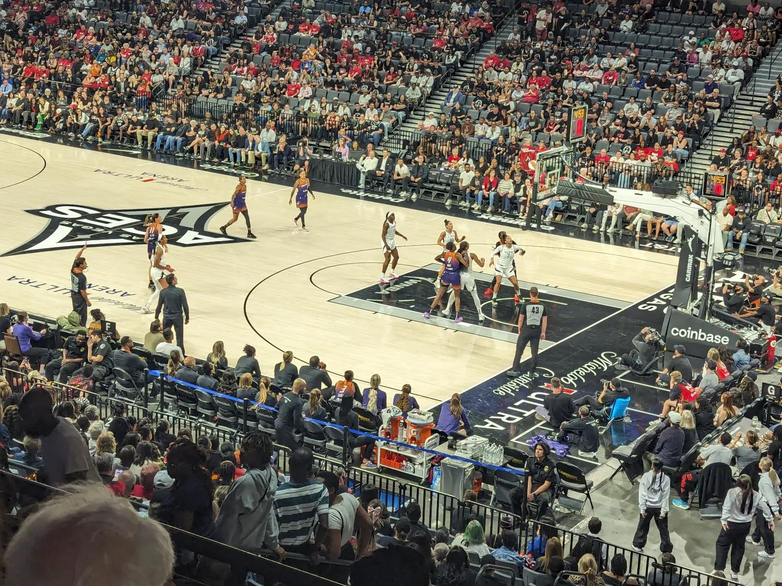 Action on the court at Michelob Ultra Arena in Las Vegas during a WNBA game.