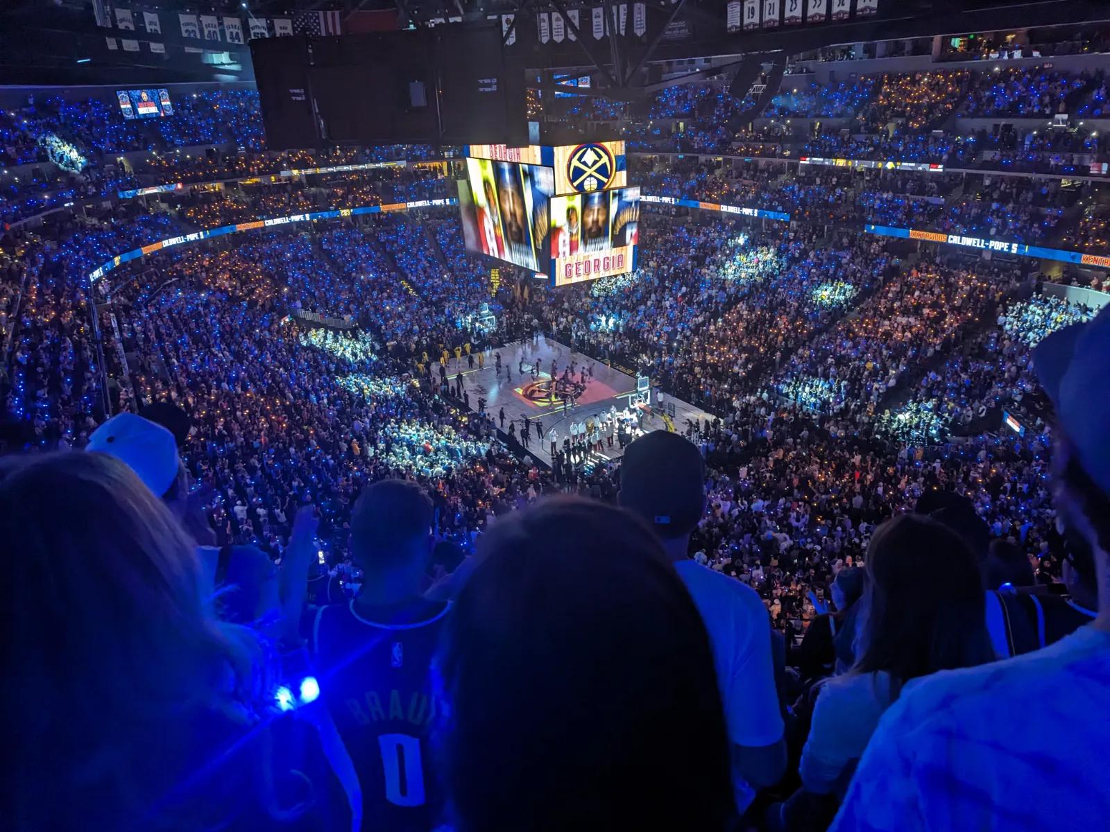 High-up view of a packed Ball Arena in Denver during a Nuggets game.