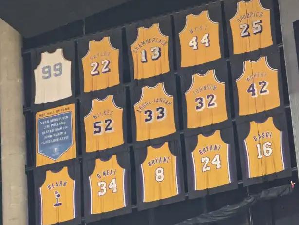 Retired jerseys hanging from the rafters at Crypto.com Arena in Los Angeles.