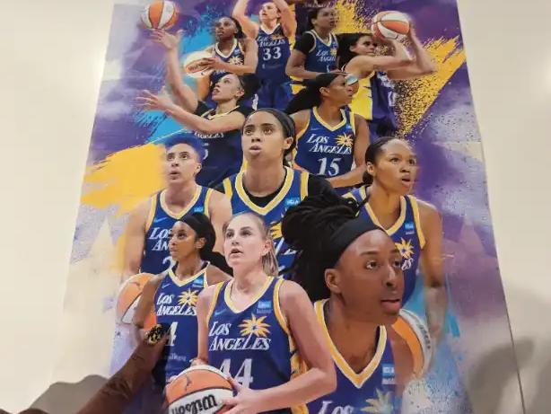 A 2023 Los Angeles Sparks team poster picked up at Crypto.com Arena.