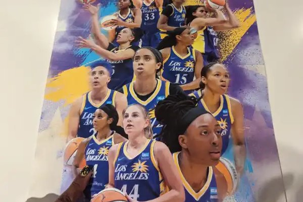 A 2023 Los Angeles Sparks team poster picked up at Crypto.com Arena.