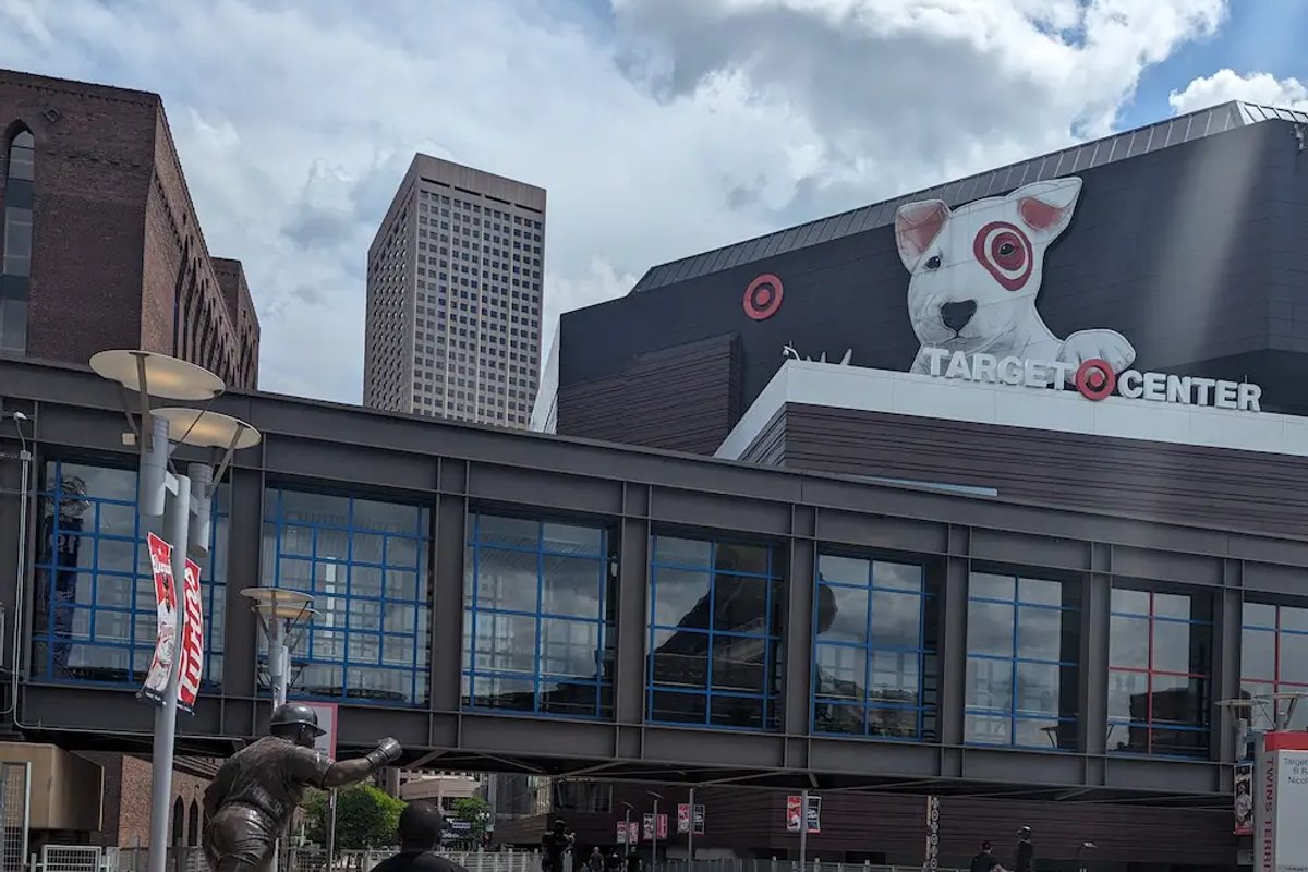 Walking toward the Target Center in Minneapolis, passing the Kirby Puckett statue outside the arena.