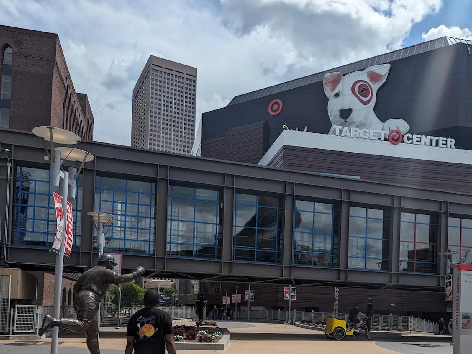 Walking toward the Target Center in Minneapolis, passing the Kirby Puckett statue outside the arena.