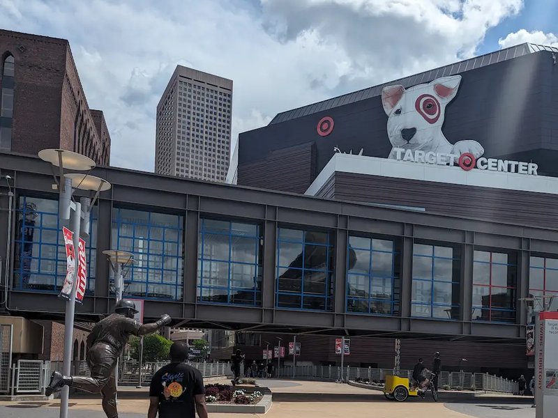 Walking toward the Target Center in Minneapolis, passing the Kirby Puckett statue outside the arena.