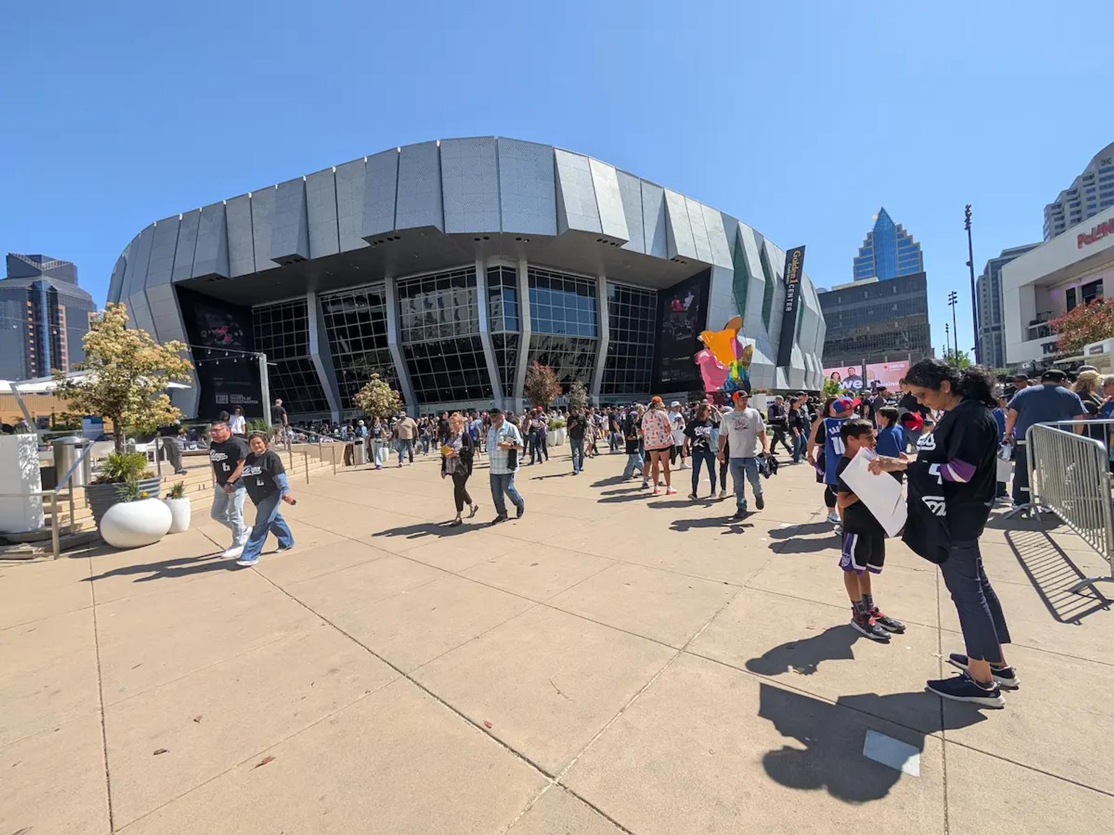 Crowds gathering outside the Golden 1 Center in Sacramento before a game.
