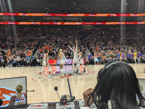 Connecticut Sun players celebrating on the court at TD Garden in Boston during halftime.