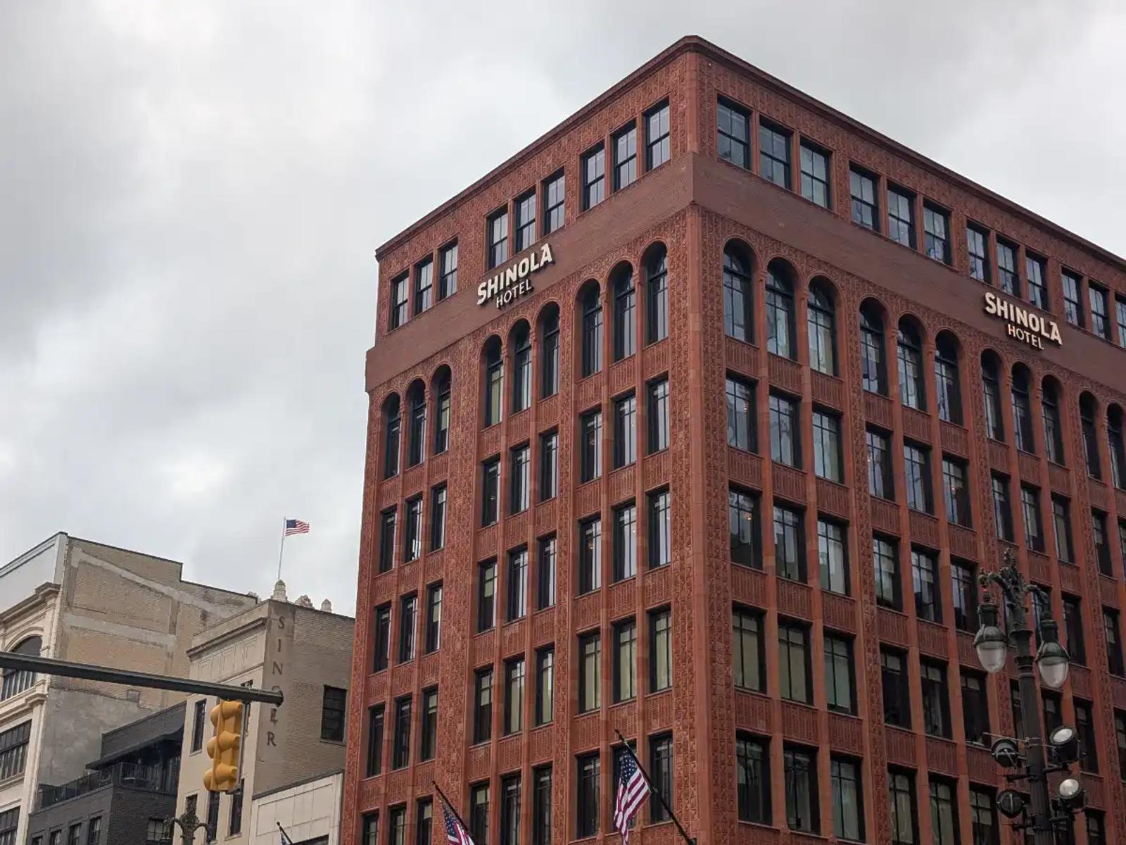 The exterior of the Shinola Hotel in downtown Detroit on a cloudy day.