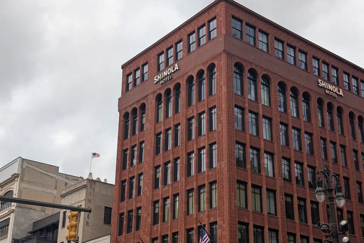 The exterior of the Shinola Hotel in downtown Detroit on a cloudy day.