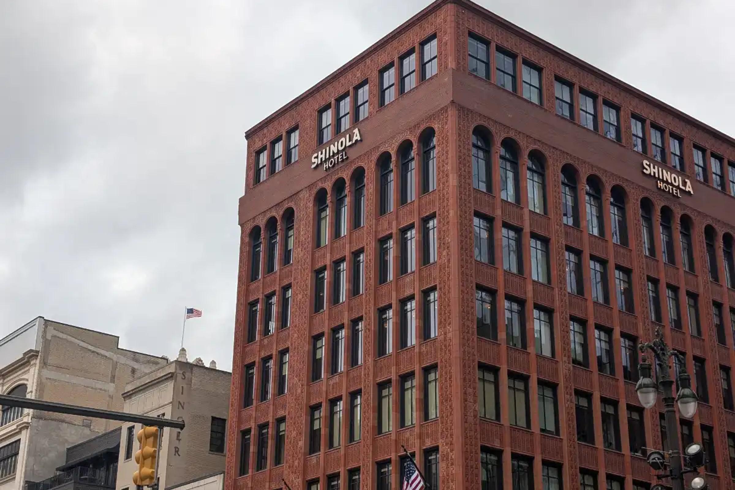 The exterior of the Shinola Hotel in downtown Detroit on a cloudy day.