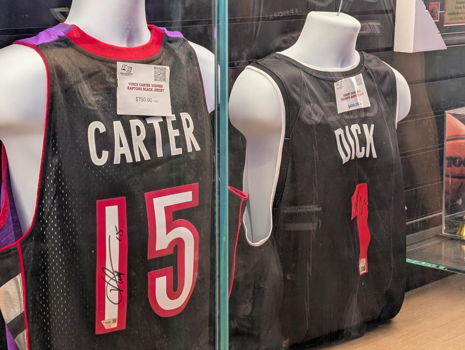 Signed Vince Carter and Gradey Dick jerseys for sale in a display case at Scotiabank Arena in Toronto.