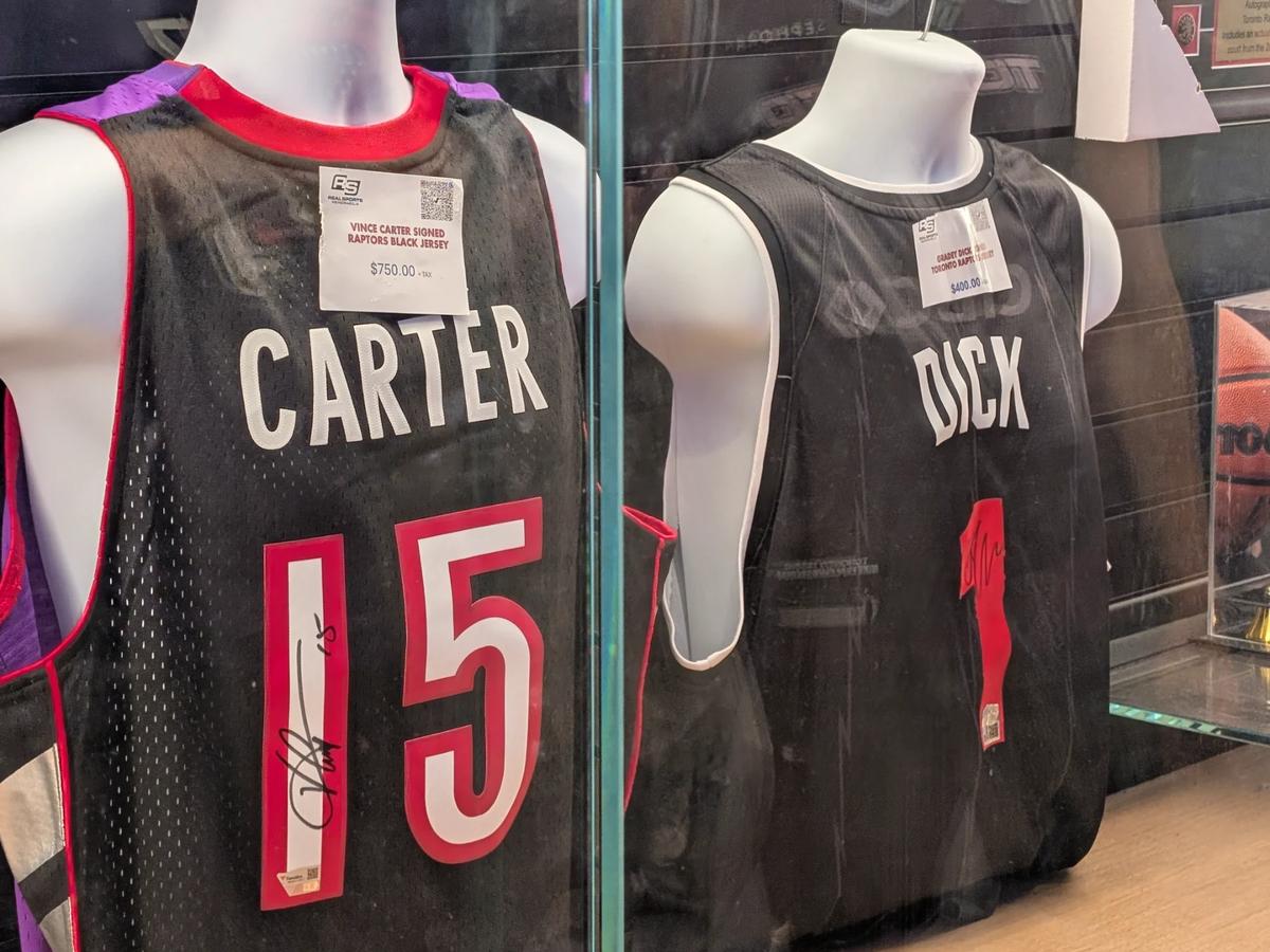 Signed Vince Carter and Gradey Dick jerseys for sale in a display case at Scotiabank Arena in Toronto.
