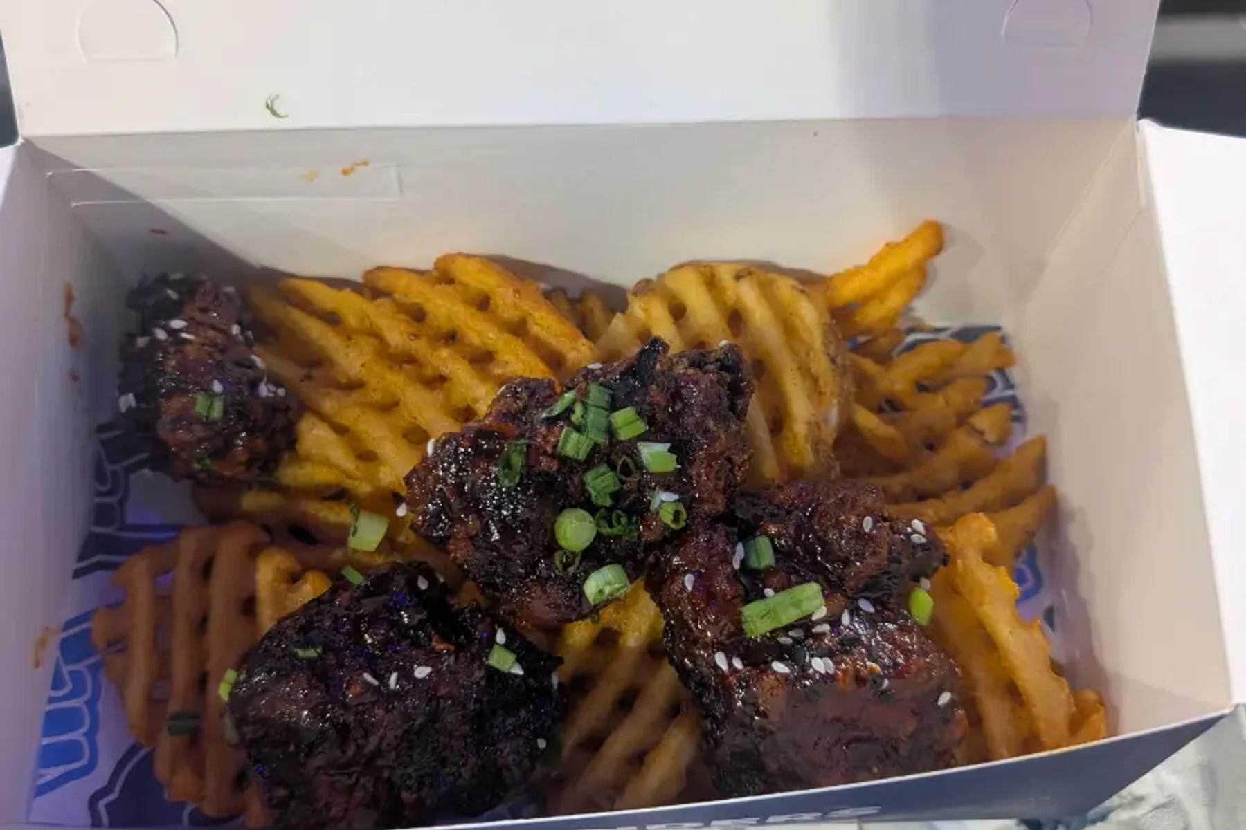 Glazed boneless wings over waffle fries