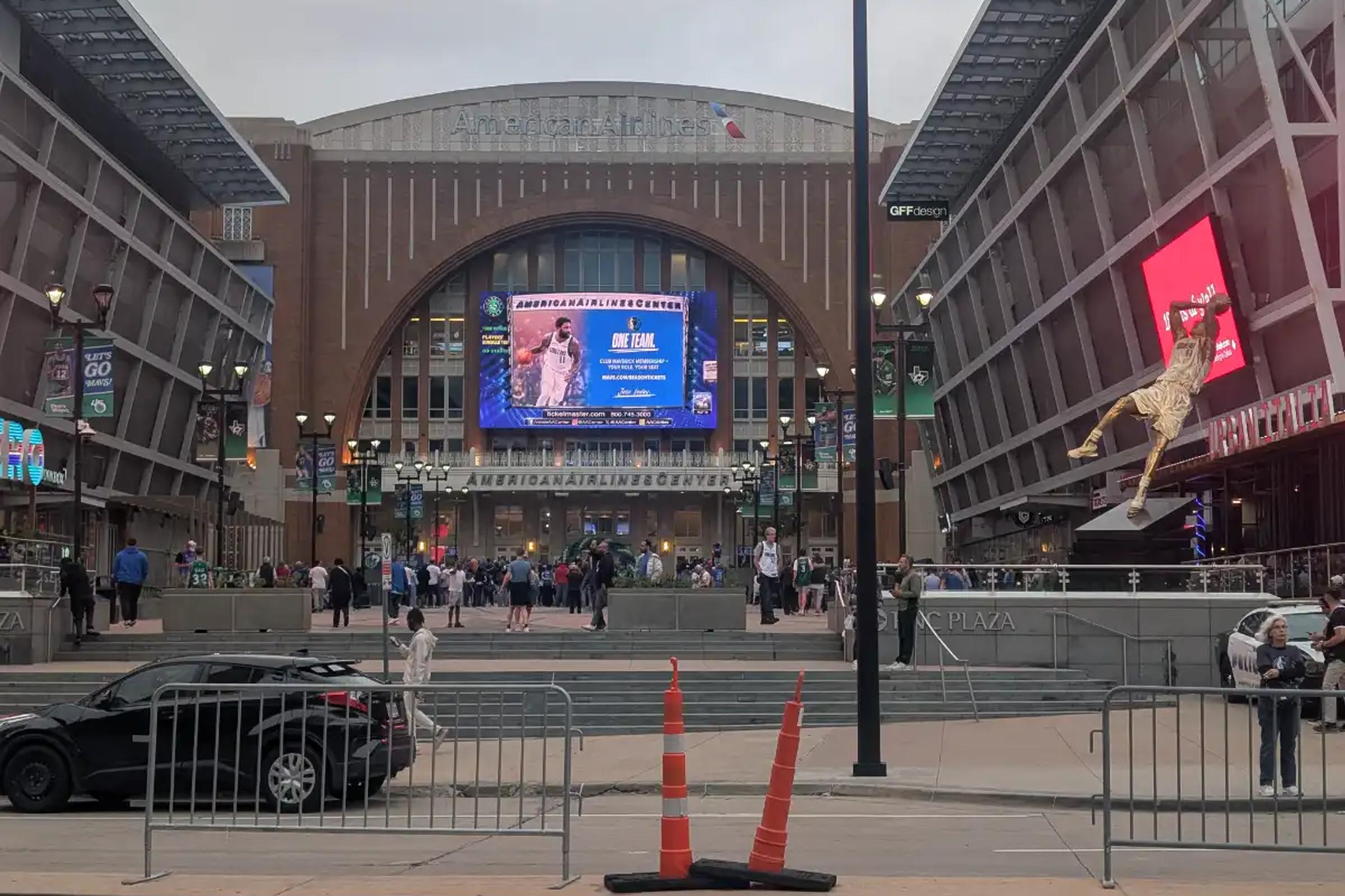 The plaza outside American Airlines Center in Dallas, complete with the Dirk Nowitzki statue and game day crowds.